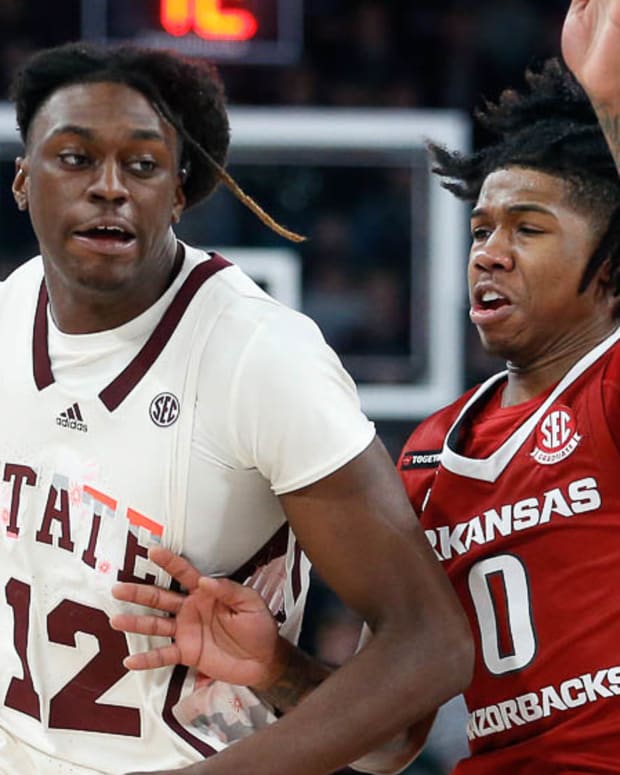 Razorbacks' Khalif Battle guarding Mississippi State's Keshawn Murphy
